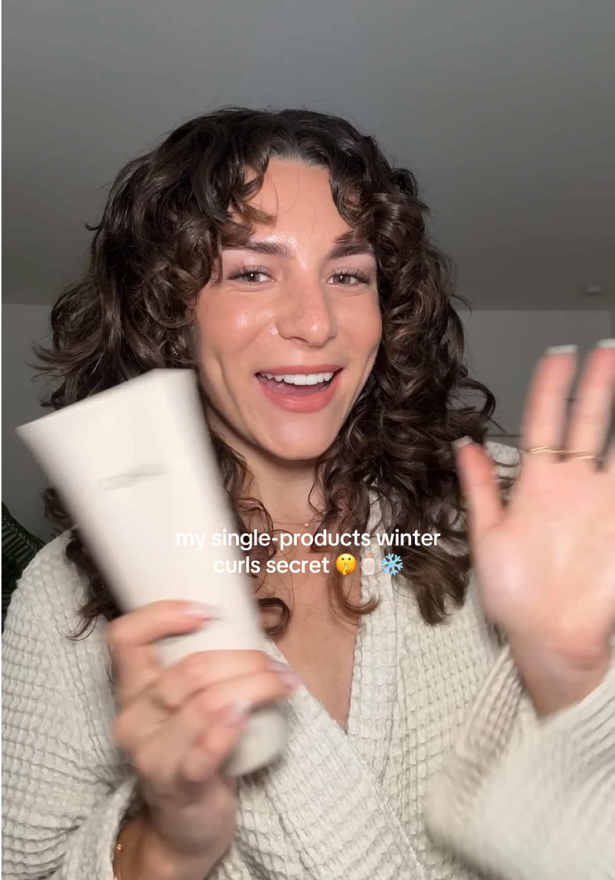 TikTok post by @itsmarinaann for OUAI. Caption reads: [...] will thank me later…shop @THE OUAI Curl....