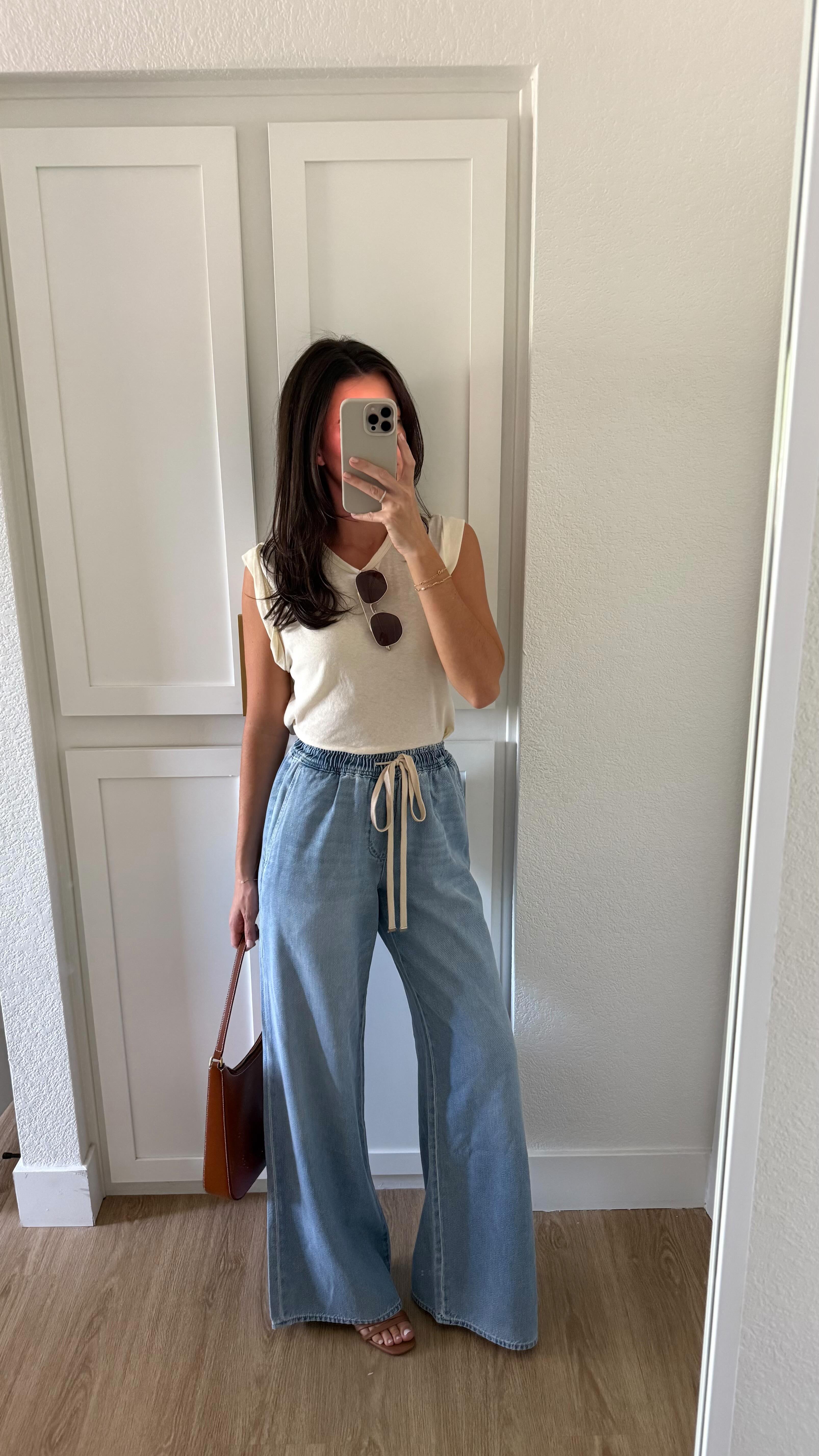 Instagram post by @cassiesethna for 7 For All Mankind. Caption reads: [...] to these outfits! This denim from....