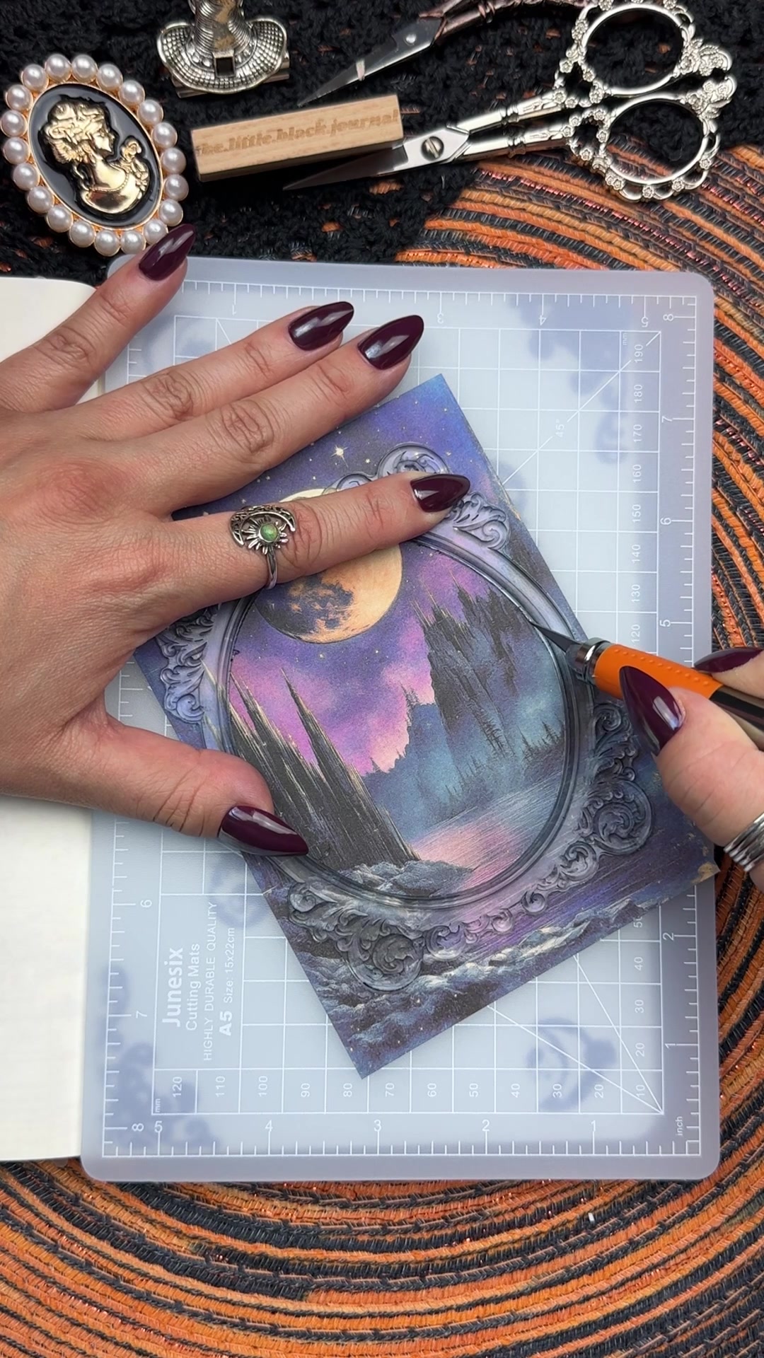 TikTok post by @the.little.black.journal for Ferris Wheel Press. Caption reads: Name this theme!? 💜✨ASMR Scrapbook Journal With....