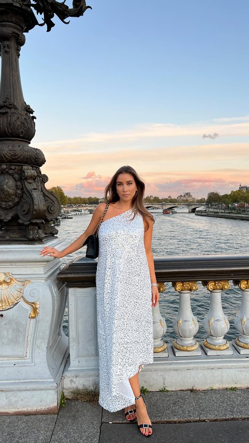 Instagram post by @emilietommerberg for Ellos. Caption reads: Annonse. My Emily dress in Paris✨ In love with....