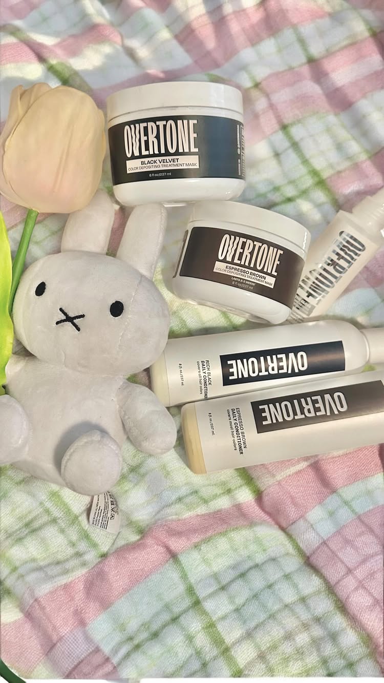 Instagram post by @twinbuns for OVERTONECOLOR. Caption reads: i named him john….and then squished him with a....