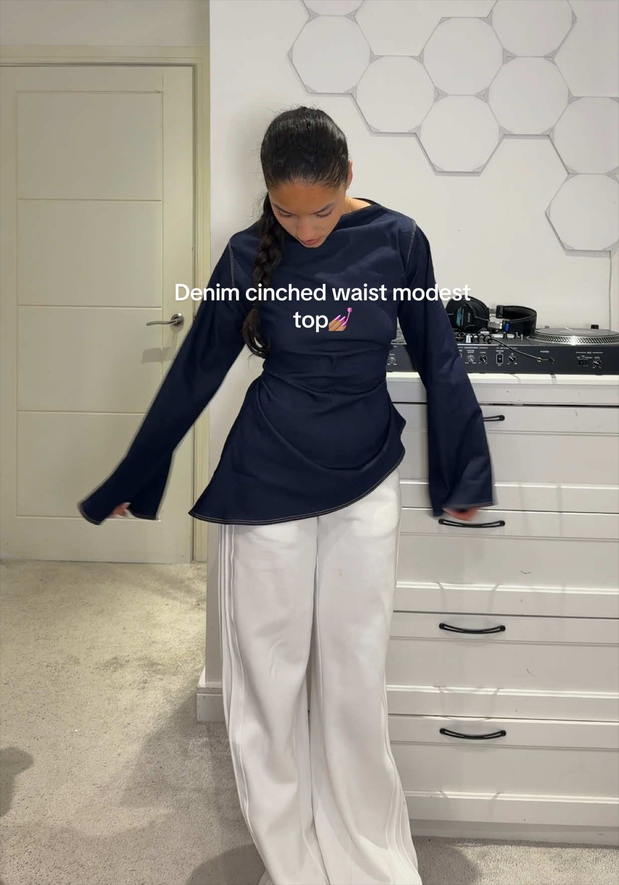 TikTok post by @tyrabaylis for emlavish. Caption reads: The tops restocked and so classy! @emlavish💓💓....