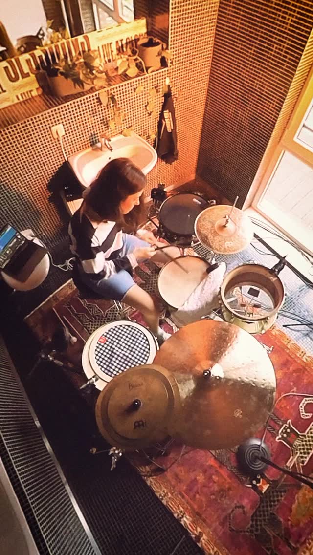 Instagram post by @iamthe_m for EVANS Drumheads. Caption reads: Surprise ✨ Bonus video from the Shower Sessions....