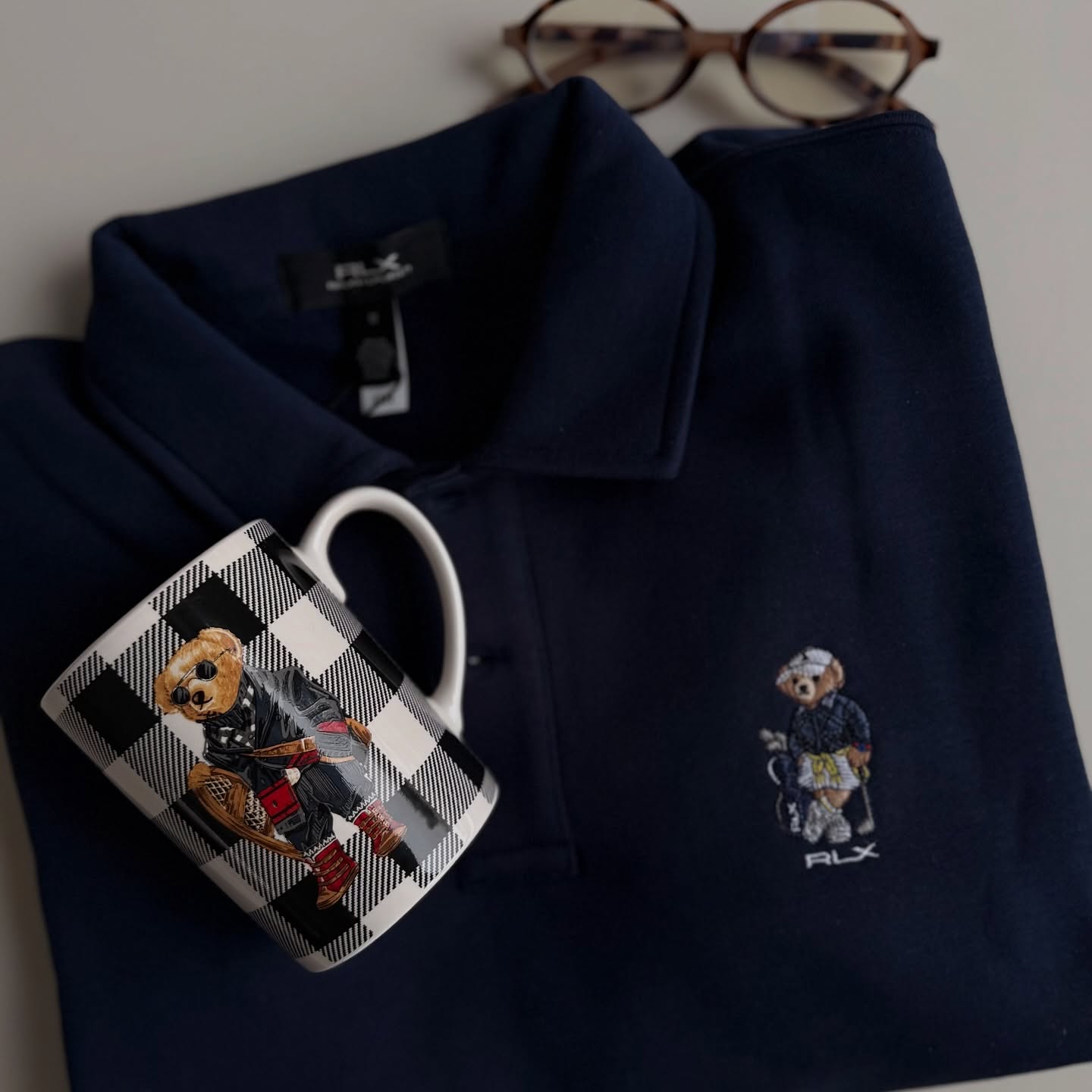 Instagram post by @simplestyle_ola for S'portofino. Caption reads: [...] detail - @ralphlauren bear🧸 Bluza....