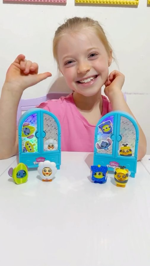 Instagram post by @kirk_family_in_warp_drive for The Entertainer. Caption reads: #Ad | Disney Doorables Costume Cuties - behind....