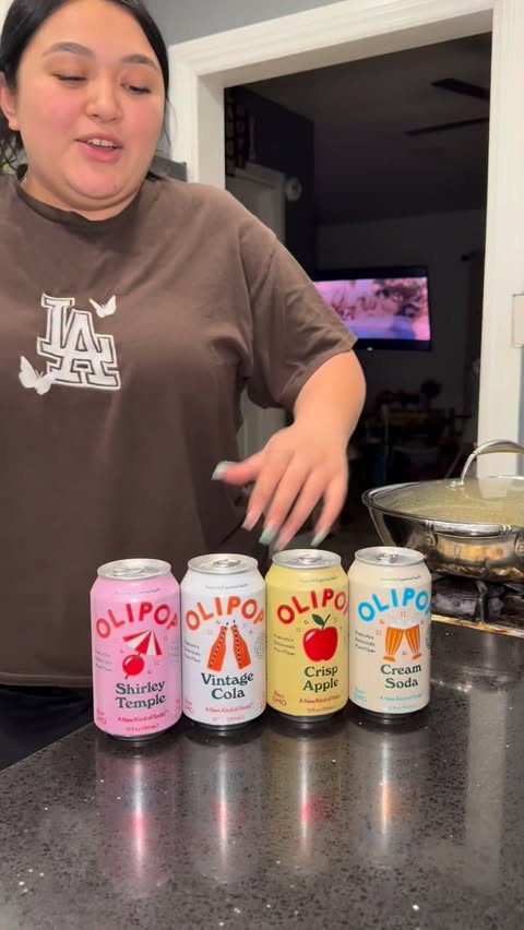 Instagram post by @angela.danii for OLIPOP. Caption reads: @drinkolipop #olipoppartner.