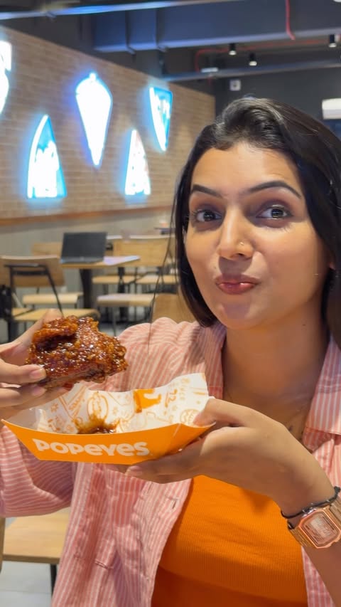 Instagram post by @deepuuofficial for Popeyes. Caption reads: [...] spicy, and a whole lot of flavour! 🍗🔥....