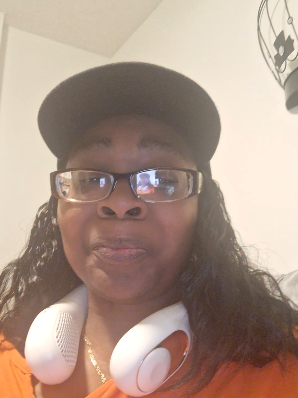 TikTok post by @angelacotman618 for Earrck shop. Caption reads: Portable Neck Fan @Earrck shop #sponsored....