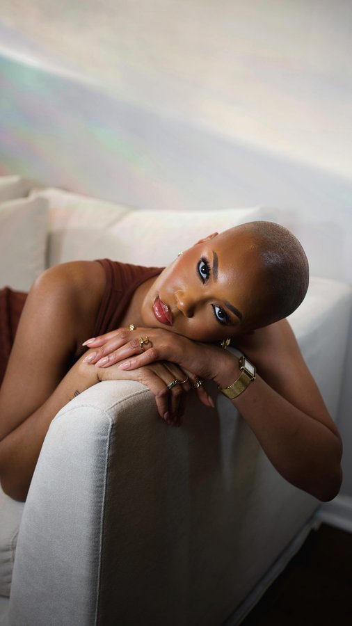 Instagram post by @chiditiffany for 25home. Caption reads: Tell me why I had a whole dark grey sectional....