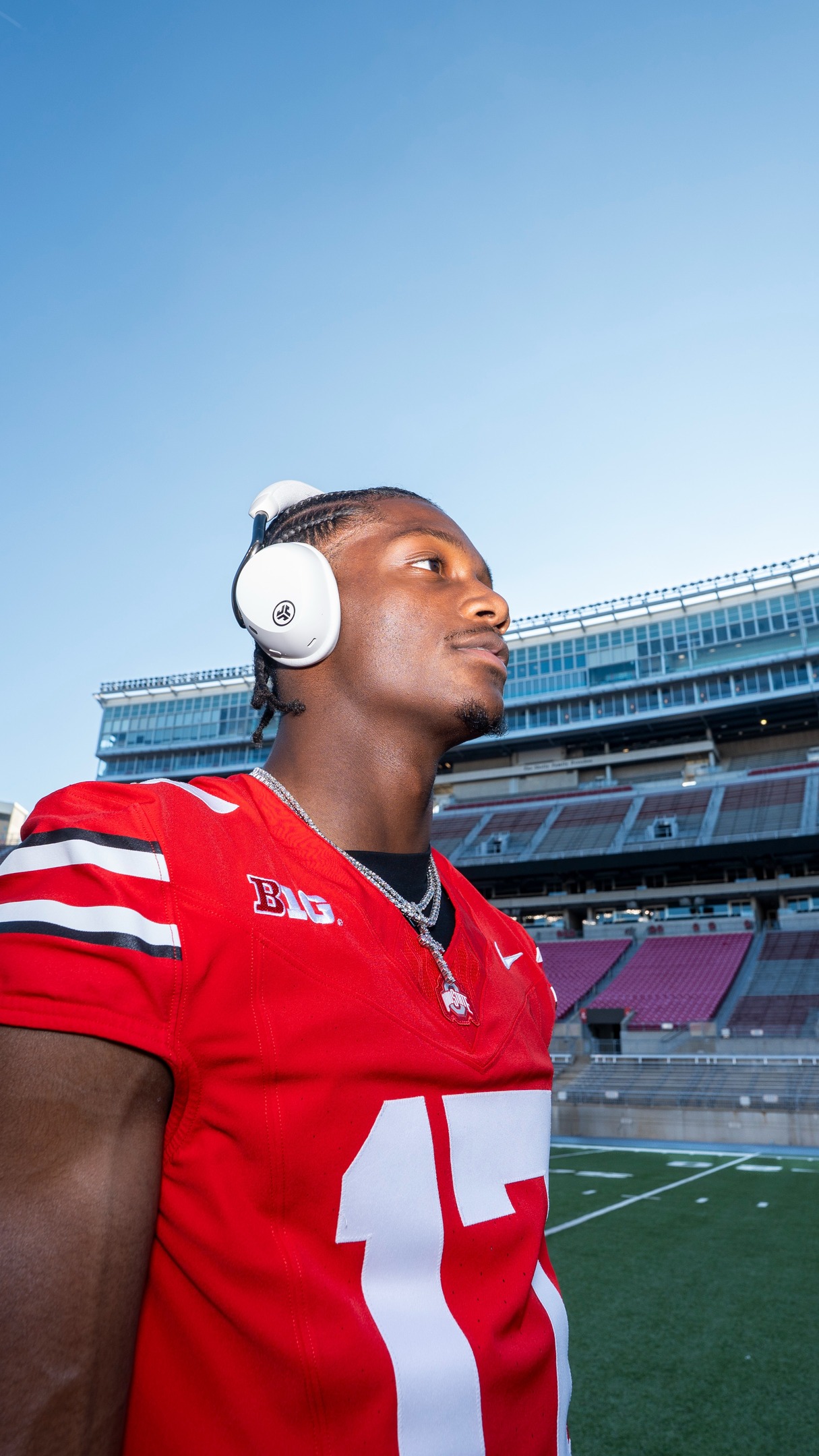 Instagram post by @carnelltate for JLab. Caption reads: Passing the aux to @carnelltate🎧🏈.