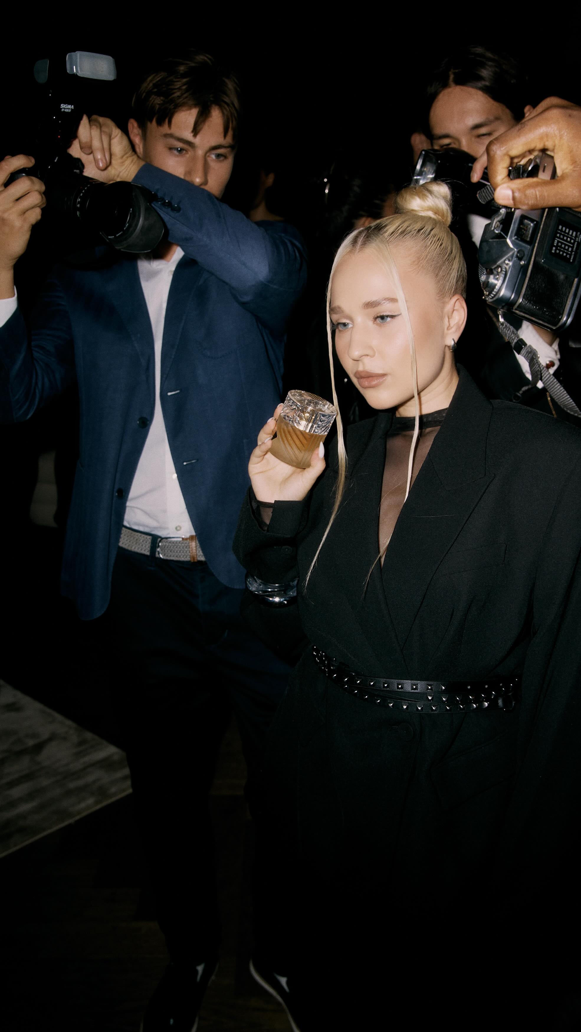 Instagram post by @natasha.divo for KILIAN PARIS. Caption reads: some fragrances whisper. this one called the....