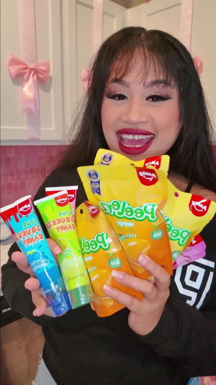 TikTok post by @jels831 for Amos Sweets. Caption reads: Amos sweets gummies with 3 sour squeeze candy....
