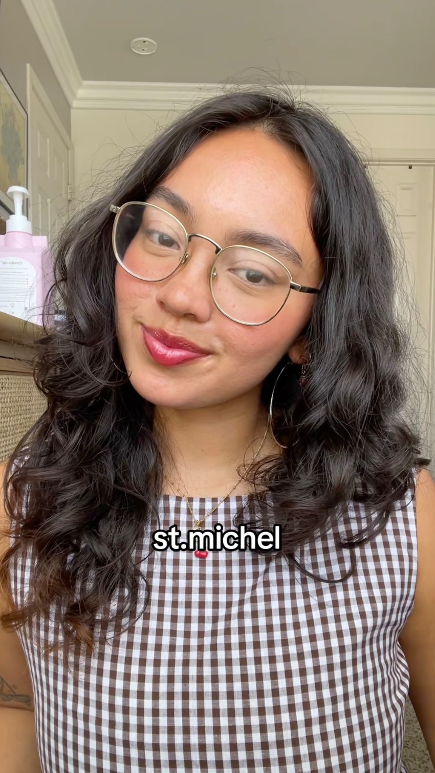 Instagram post by @basicallykaity for EyeBuyDirect. Caption reads: the glasses that get me the most compliments! 🦢....