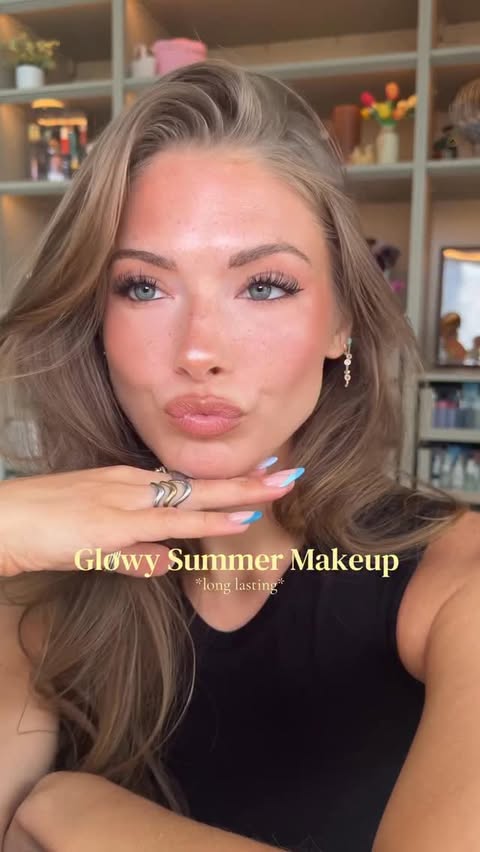 Instagram post by @kayla.ryan1 for Clinique. Caption reads: glowy summer makeup essentials ☀️👙🐠🌺....