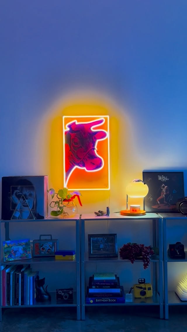 Instagram post by @christianzajicek for Yellowpop. Caption reads: [...] neon version of Andy Warhol’s Cow from....