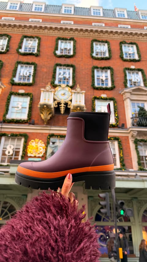 Instagram post by @styled.daisy for Merry People. Caption reads: ad | from puddles to parties with @merrypeople 🥾....