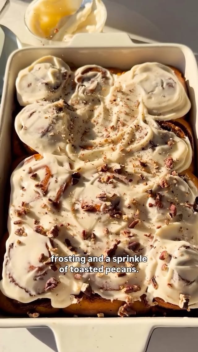 Instagram post by @bcais for Delish. Caption reads: These Pumpkin Cinnamon Rolls are the perfect....