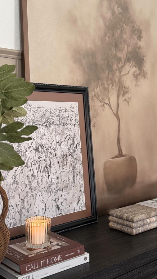 Instagram post by @jennas.home for Frame It Easy. Caption reads: Layered frames for a beautiful collected look. Art....