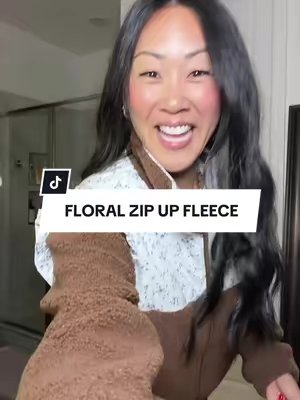 TikTok post by @jwhittysells for Imilybela. Caption reads: Ummm the CUTEST zip up fleece!!!😍 The floral....