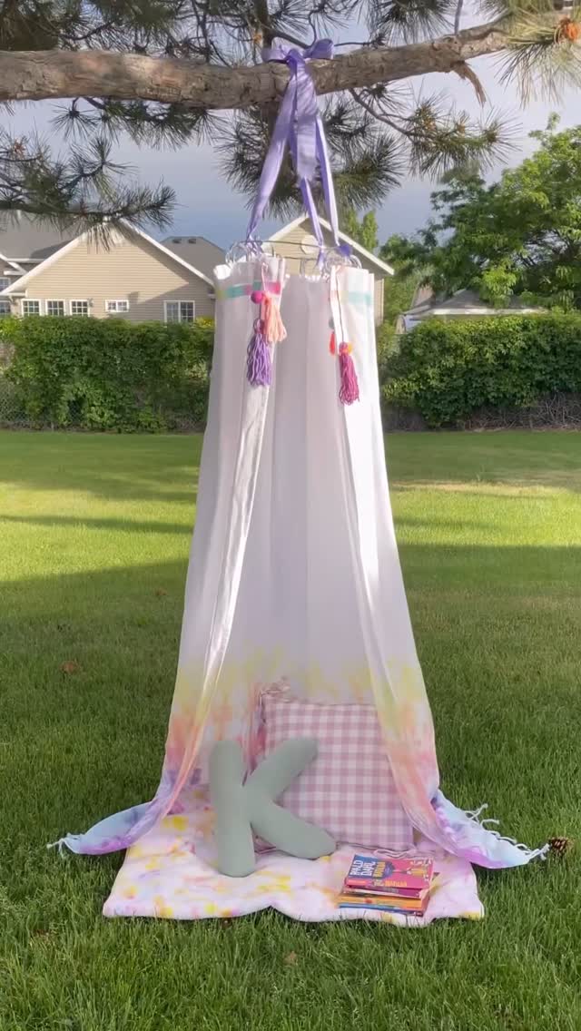 Instagram post by @agirlandagluegun for Hobby Lobby. Caption reads: Make this easy DIY kids’ tie-dye play tent that....