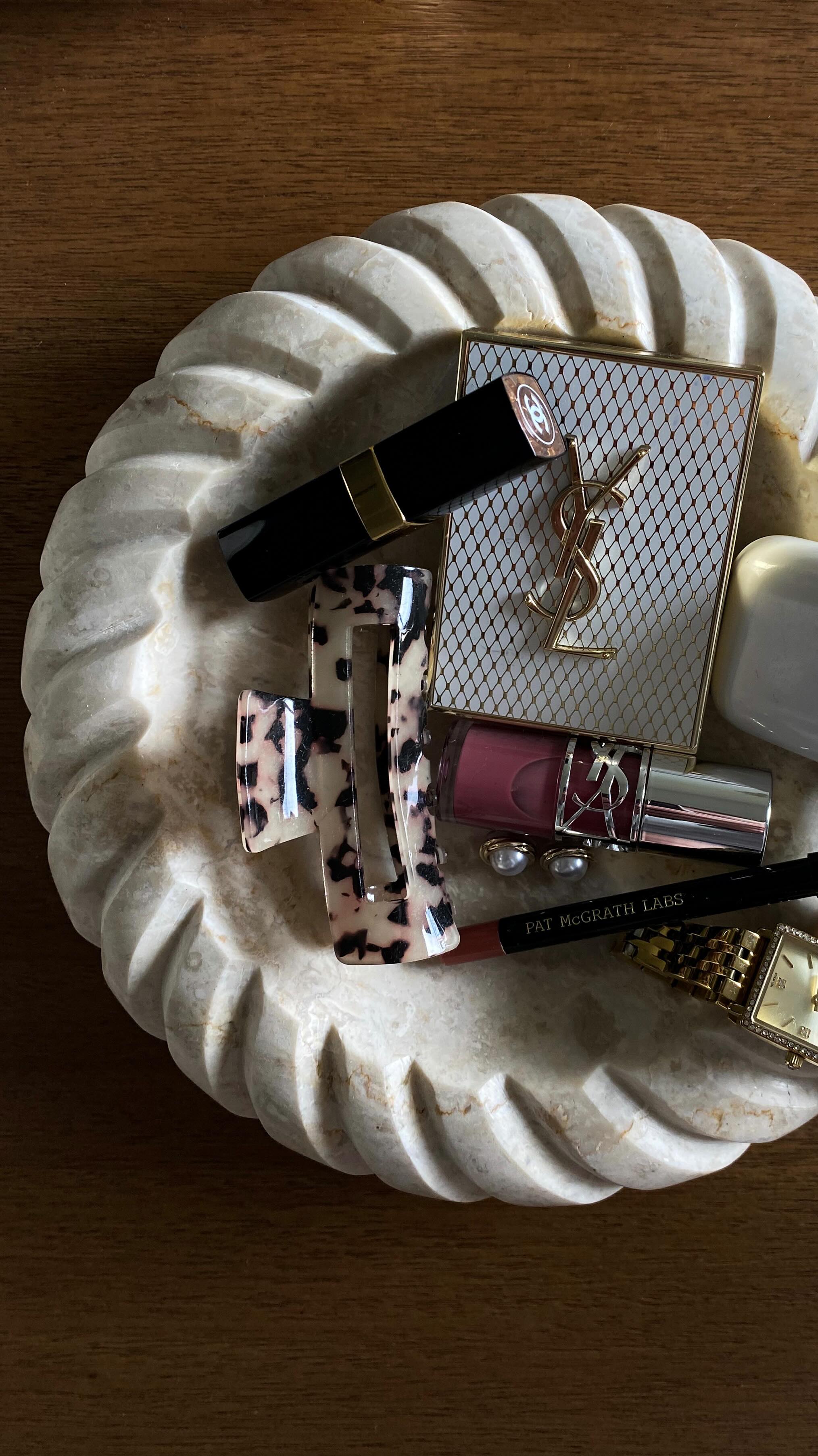 Instagram post by @simplykassx for Larsson & Jennings. Caption reads: the purse bowl 👛 aka lip products and....