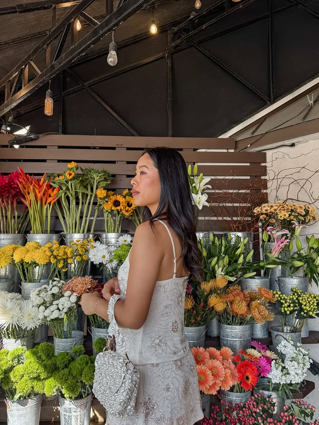 Instagram post by an influencer for Lulus. Caption reads: Flower shopping 💐 @lulus #lulusambassador....