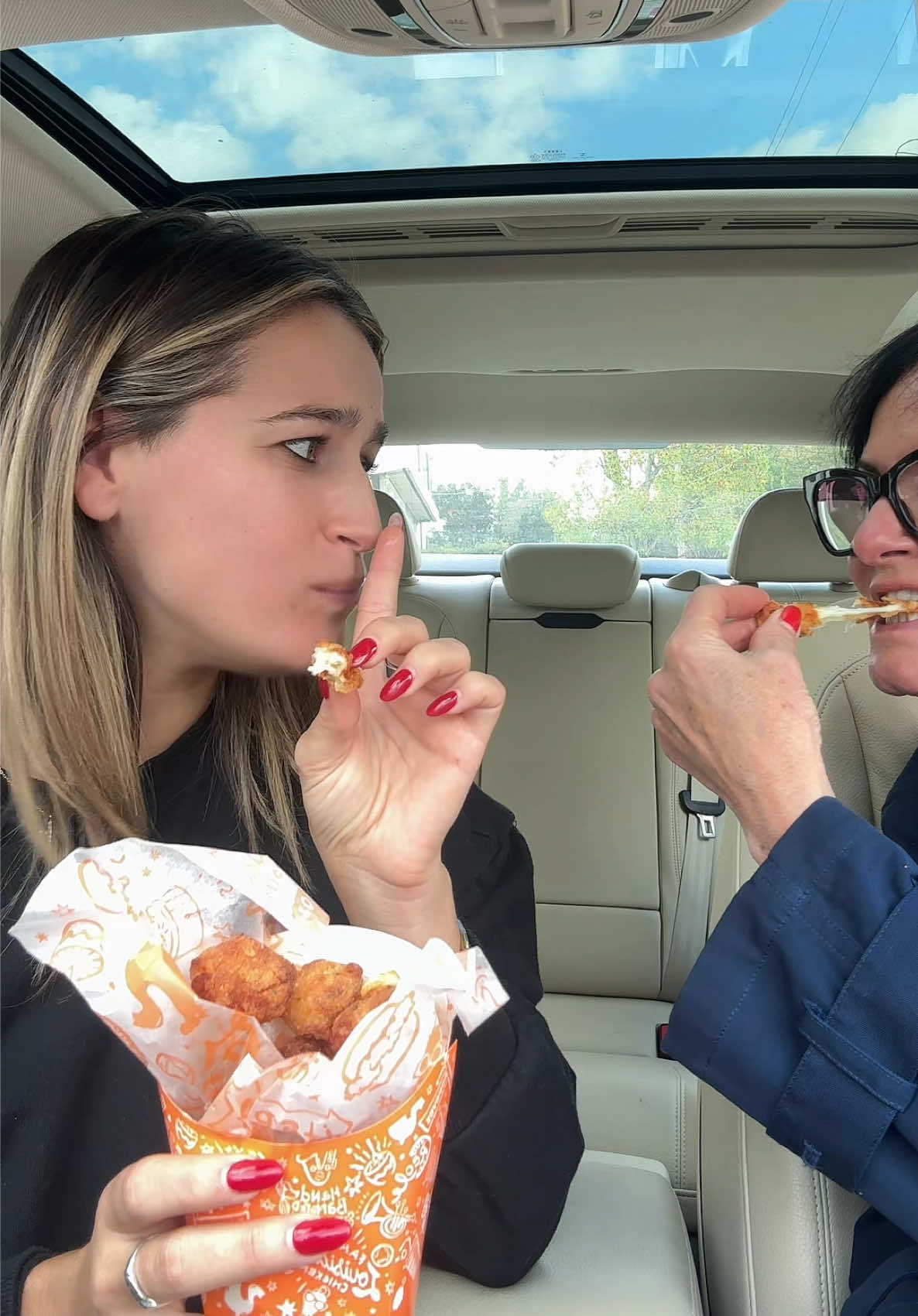 TikTok post by @calleyblue for Popeyes. Caption reads: My mom and the cheese pull hahahah @Popeyes .