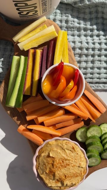 Instagram post by @eatingfineonadime for The Isopure Company. Caption reads: #ad HIGH-PROTEIN HUMMUS HACK! Adding unflavored....