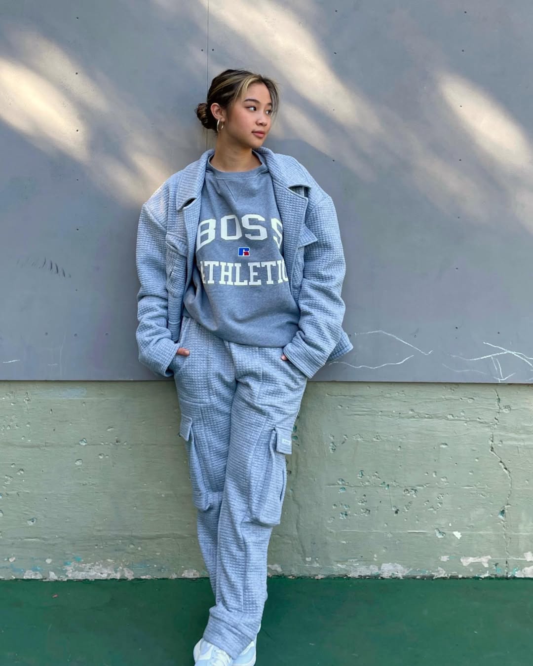 Instagram post by @isaasung for Russell Athletic. Caption reads: vibin‘ w/ @russellathletic x @boss 🖤check out my....