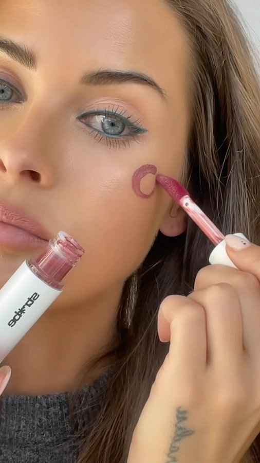 Instagram post by @murielle for Laura Mercier. Caption reads: [...] Exclusive Afterglow Lip Shine Orgasm....