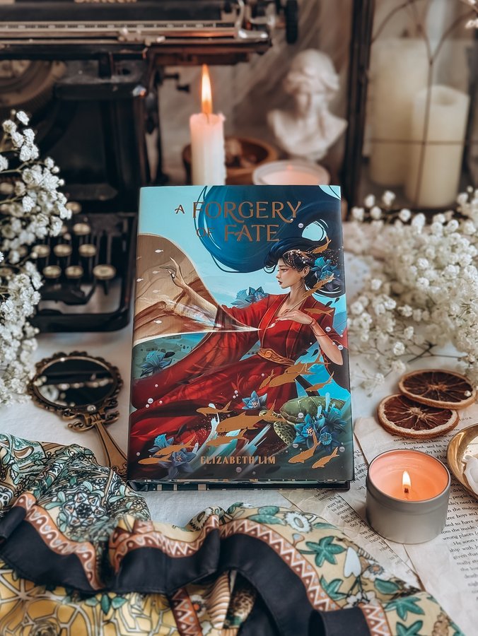 Instagram post by @thebookscript for OwlCrate. Caption reads: ✨OWLCRATE FEATURE✨ A Forgery of Fate by Elizabeth....