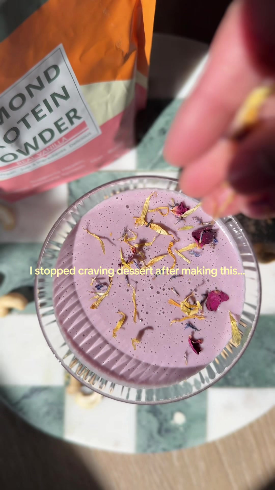 TikTok post by @justsweetrawness for Wellious. Caption reads: [...] #plantbasedprotein #proteinpowder #ube....