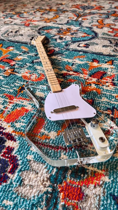 Instagram post by @jmudrums for Loog Guitars. Caption reads: [...] to announce I have partnered with....