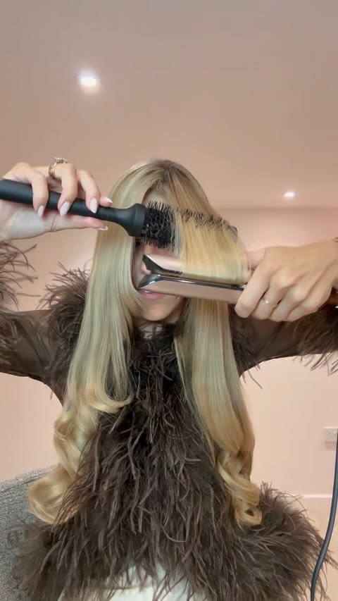 Instagram post by @naomibouncyblows for ghd hair. Caption reads: ✨ Cashmere Christmas hair ✨ @ghdhair My favourite....