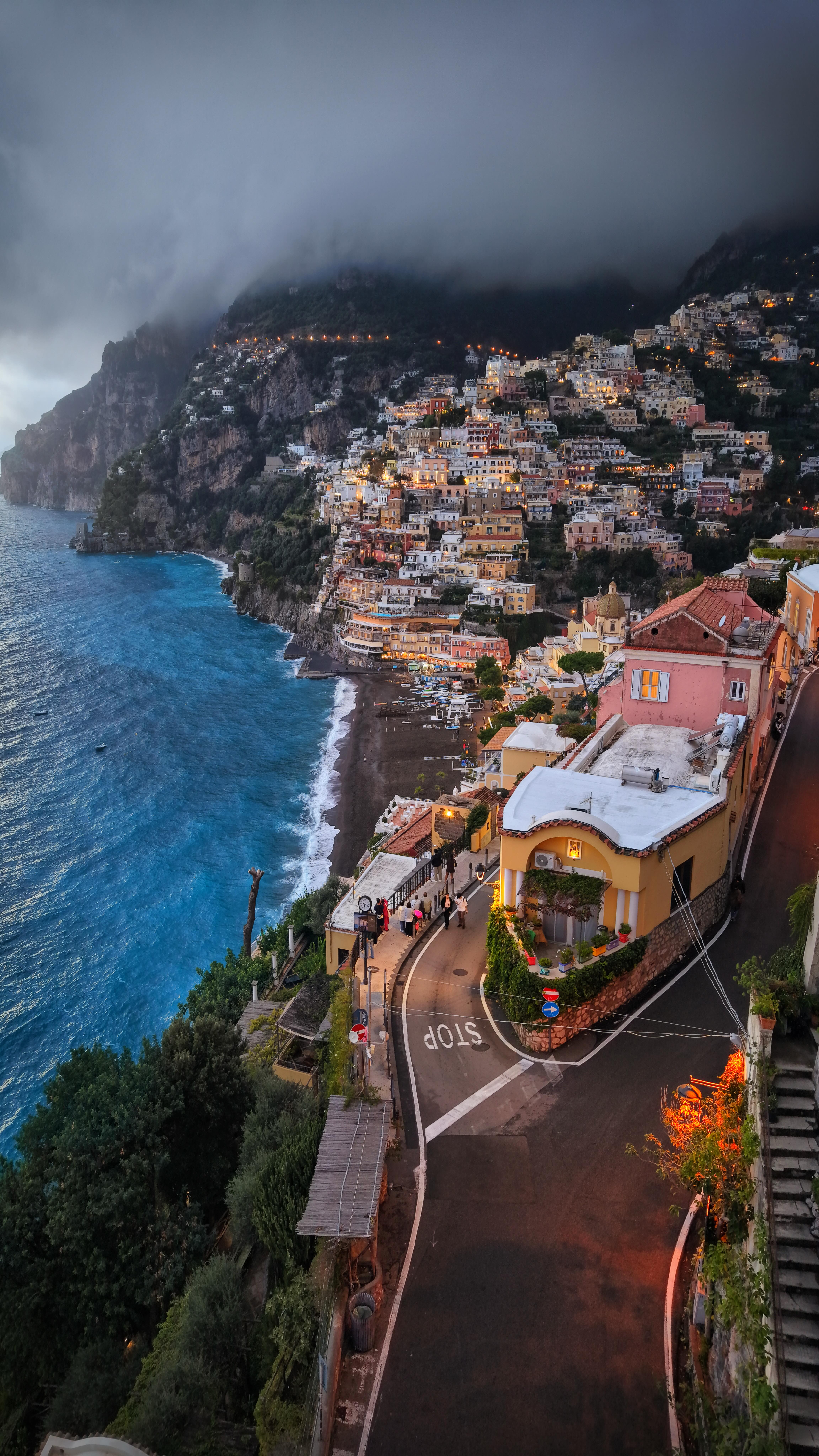 Instagram post by @butnomatter.theroadislife for Holafly. Caption reads: You’re exploring Positano in Italy or crossing the....