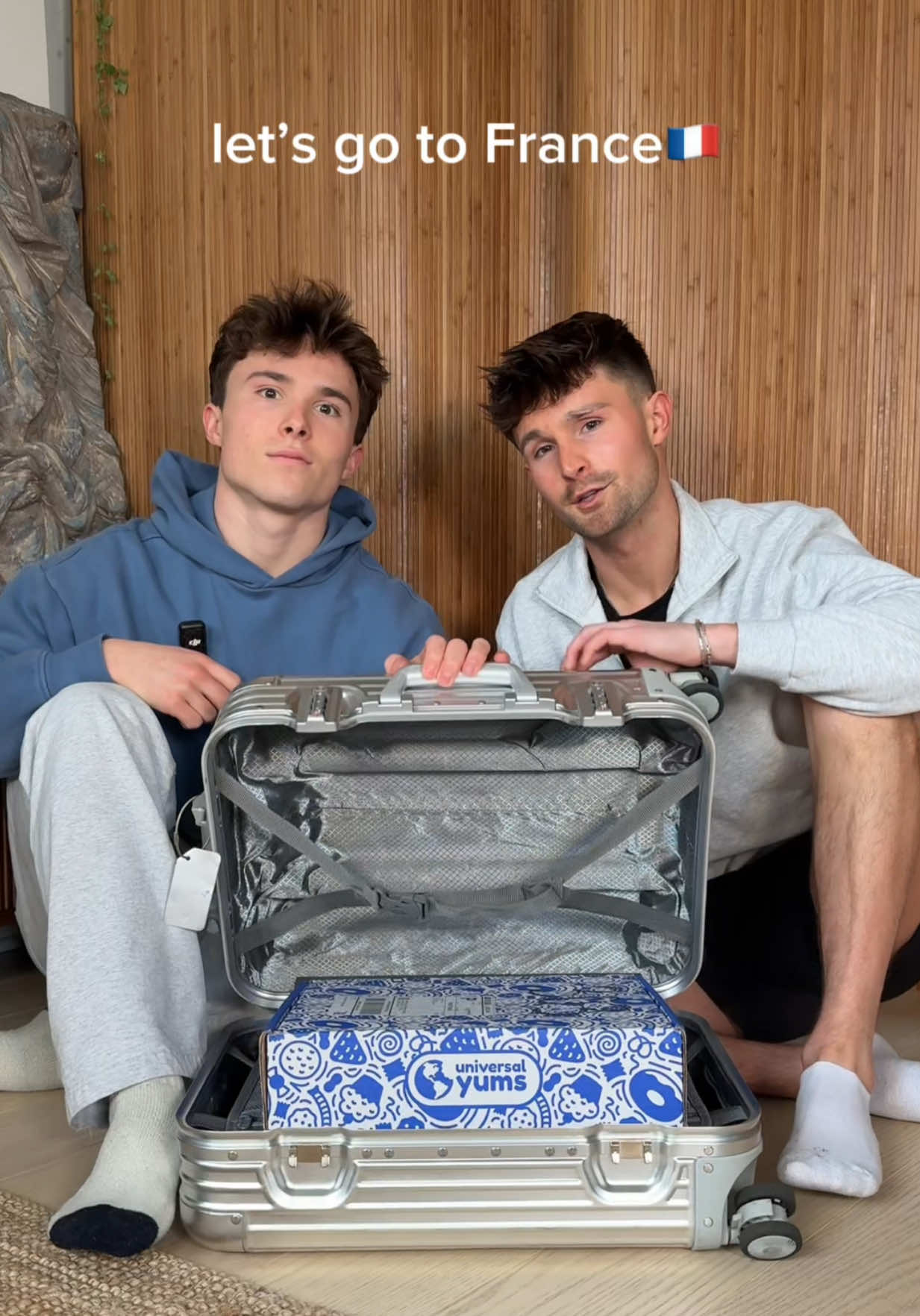 TikTok post by @griffinandspencer for Universal Yums. Caption reads: Jet lag? No. French snacks? Oui!🥖🇫🇷 tasting our....