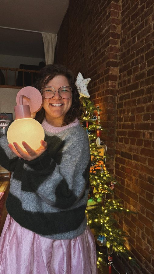 Instagram post by @sydney_benjamin for The Poplight. Caption reads: [...] lighting in my apartment thanks to....