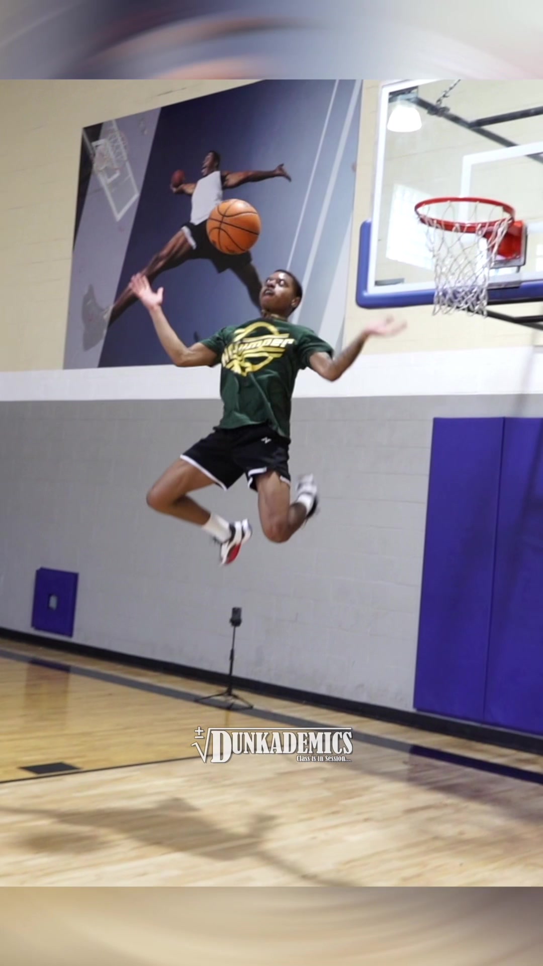 TikTok post by @dunkademics for Accelerator Active Energy. Caption reads: [...] Dunk from @t.currie powered by @Accelerator....