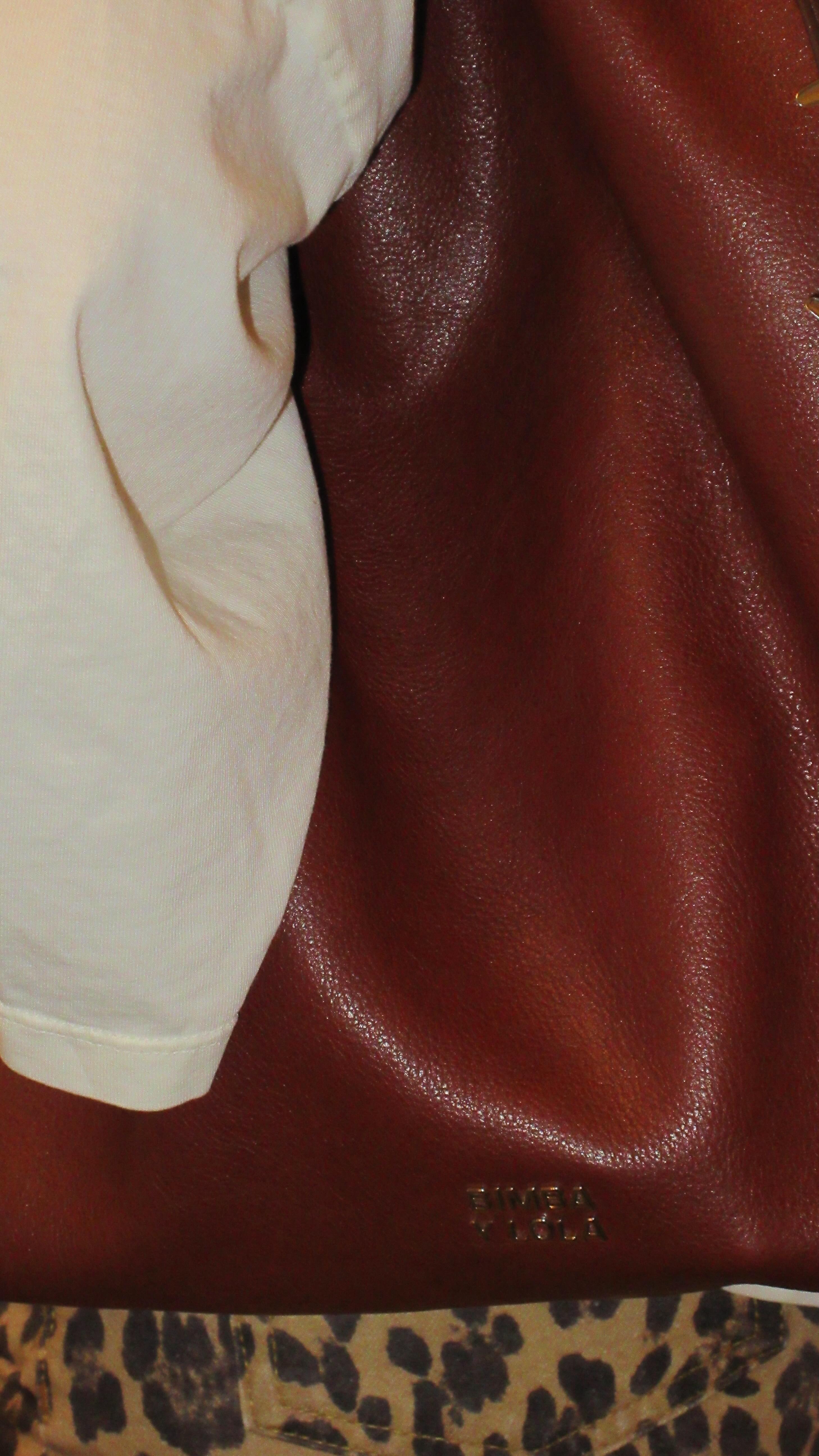 Instagram post by @dalexaofc for BIMBA Y LOLA. Caption reads: Check it out 🪩🤎 
Full look @bimbaylola.