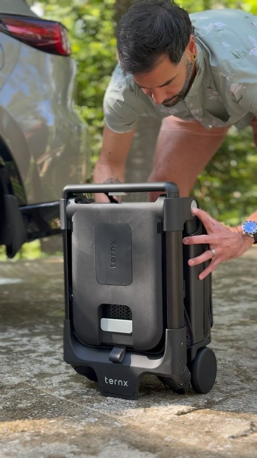 Instagram post by @papi_and_papa for TernX. Caption reads: [...] doubles as a stroller ✈️
.
.
.
.
#ad....