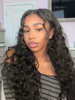 TikTok post by @morgankbs for Tinashe Hair. Caption reads: @tinashehair ➿ #beachcurly#halfwig#vpartwig [...].