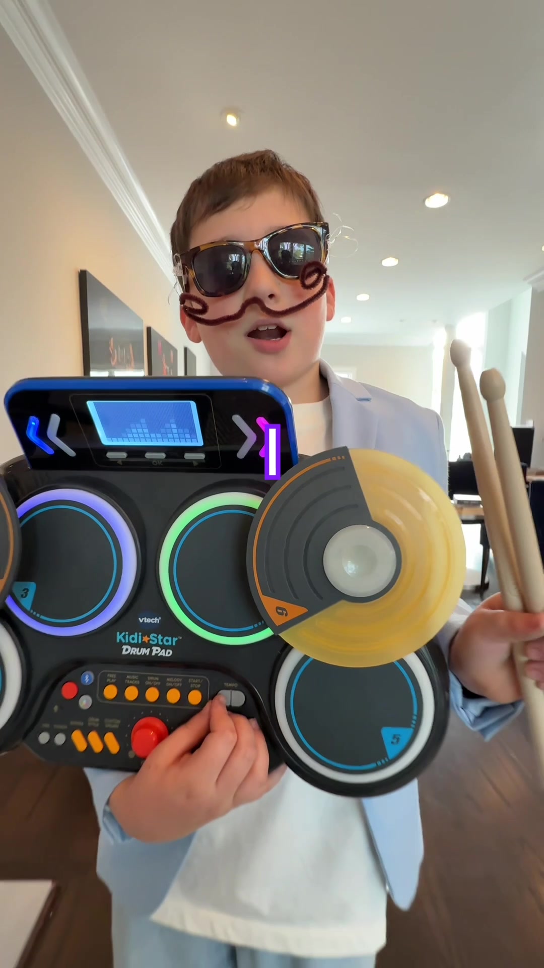 TikTok post by @milesmusickid for VTECH. Caption reads: DJ Mustachio saves the day again with the VTech....