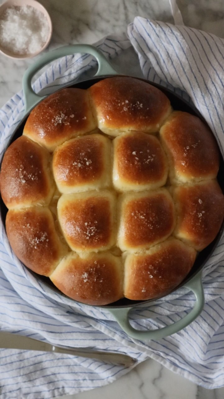 Instagram post by @jenniferlatham for Le Creuset. Caption reads: Dinner rolls in my favorite @lecreuset bread....