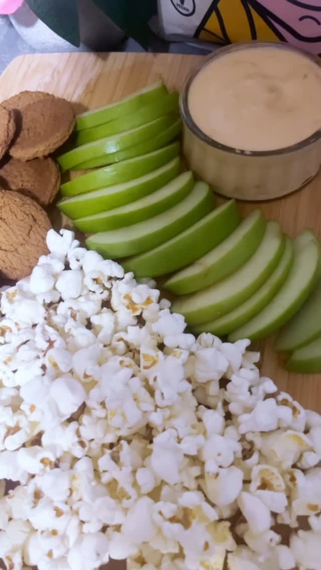 Instagram post by @royalteay for LesserEvil Kids. Caption reads: 🍿 Let’s make a healthy movie night charcuterie....