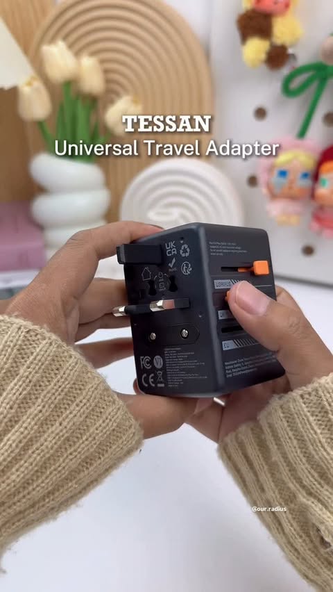 Instagram post by @our.radius for Shopee Malaysia. Caption reads: Universal Travel Adapter with USB+Type C TESSAN....