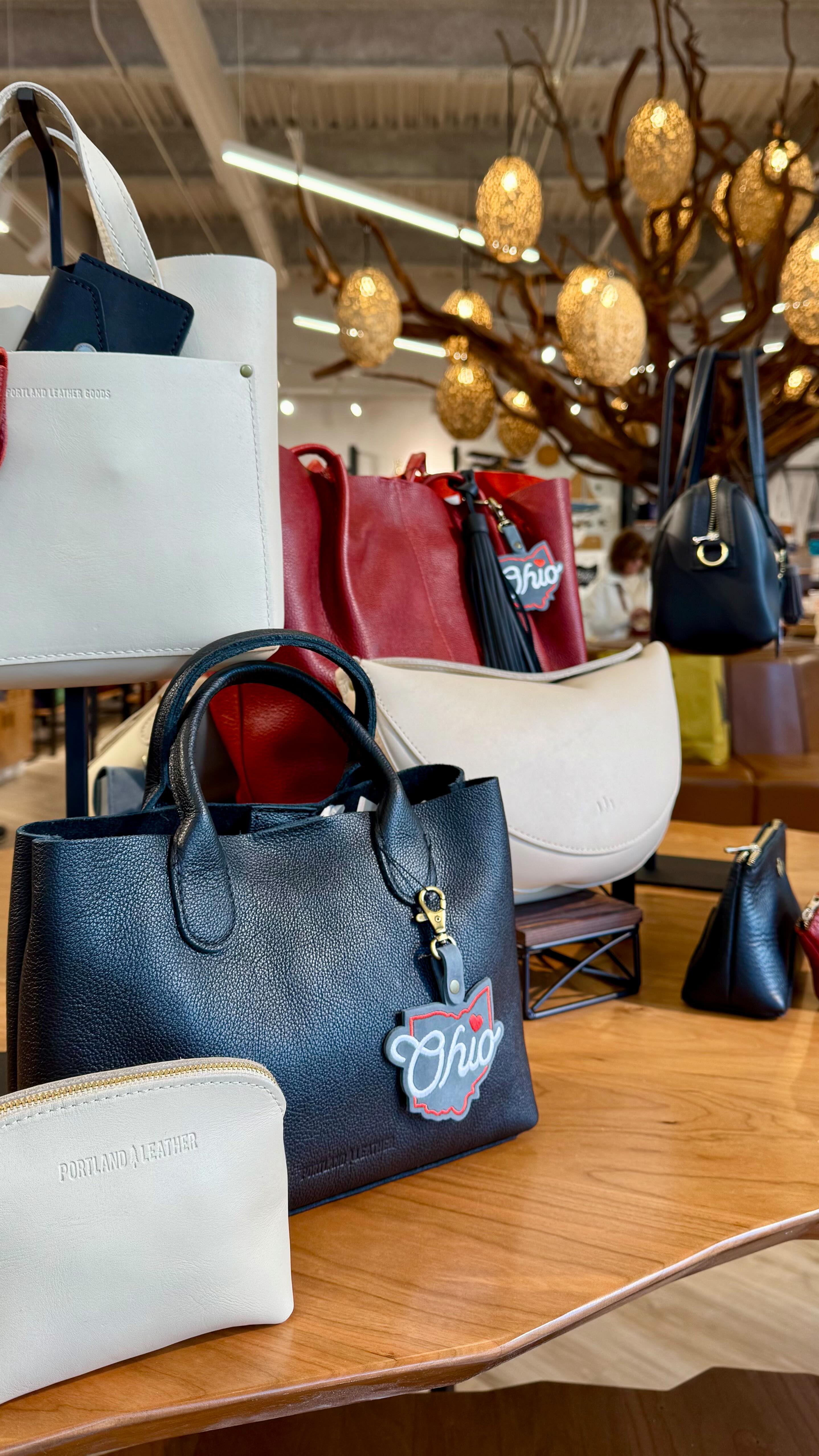 Instagram post by @eastontownctr for Portland Leather Goods. Caption reads: Welcome to Easton, @portlandleather! 🎉 Celebrate....