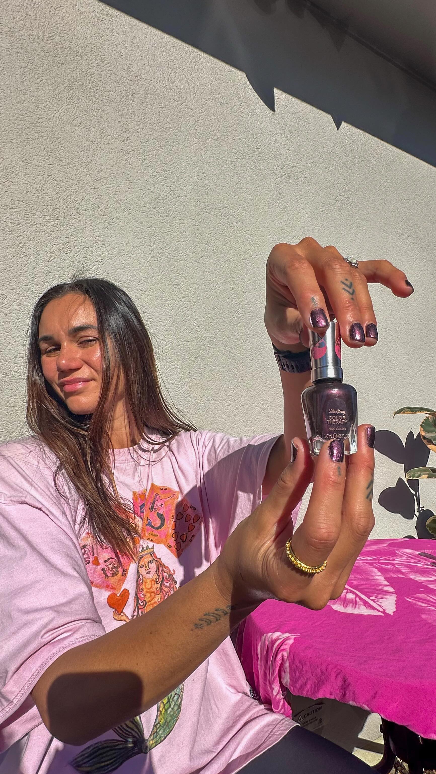 Instagram post by @ameliaranne_ekenasio for Sally Hansen. Caption reads: AD Game Day nails with @sally_hansen Color Therapy....
