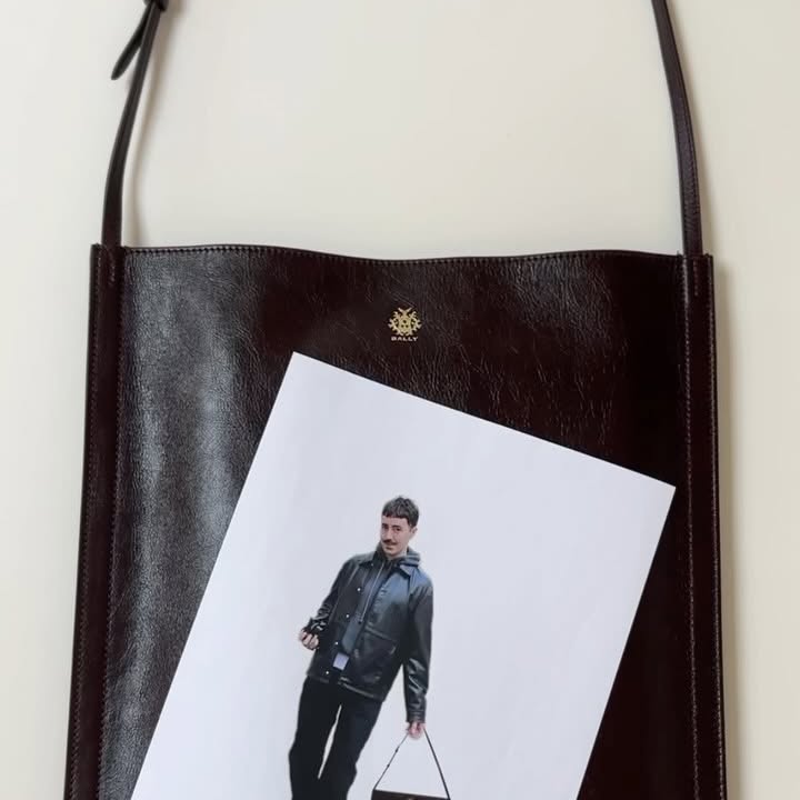 Instagram post by @cupofcouple for Bally. Caption reads: 💡 What’s in my bag @bally edition.