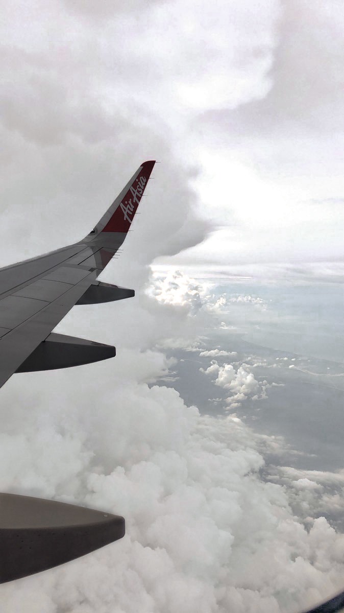 Instagram post by @davesoriano_ for AirAsia MOVE. Caption reads: [...] of fees and surcharges! Book now via AirAsia....