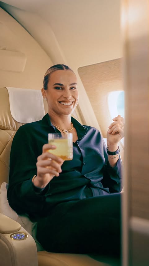 Instagram post by @arynasabalenka for Emirates. Caption reads: [...] 🎾✈️
 
First Class service!
 
#Emirates....